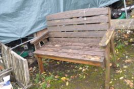 A MODERN PINE GARDEN BENCH with slatted seat and back width 134cm Condition Report. Paint