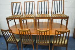 A MID CENTURY TEAK G PLAN OVAL EXTENDING DINING TABLE, with a single fold out leaf, extended