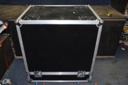 A LARGE STACKING FLIGHT CASE with four handles, four wheels and butterfly catches width 84cm depth