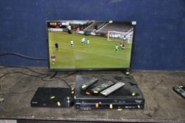 A SHARP AQUOS 32BC1K-P 32in SMART LED LCD TV with remote, a Panasonic DVD/Video player with remote