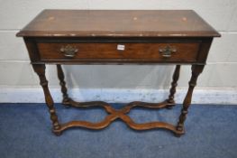 A REPRODUCTION OAK SIDE TABLE, with a single frieze drawer, on turned supports, united by a shaped