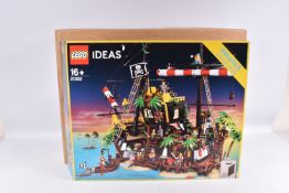 A BOXED LEGO IDEAS 030 PIRATES OF BARACUDA BAY SET, numbered 21322, box has been opened from one