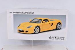A BOXED AUTOART MILLENIUM 1:18 SCALE PORSCHE CARRERA GT DIECAST MODEL VEHCLE, numbered 78043, in