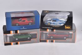 FOUR BOXED IXO MODELS DIECAST MODEL VEHICLES, the first is a 1:43 scale Toyota TS010 CASIO #33 P.