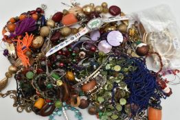 A BAG OF ASSORTED COSTUME JEWELLERY PIECES, to include various gold plated bangles, chains, rings,