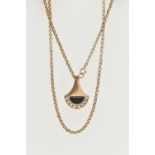 A 9CT YELLOW GOLD DIAMOND AND ONXY PENDANT WITH CHAIN, the abstract design pendant set with an