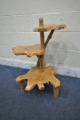 A RUSTIC LIVE EDGE THREE TIER STAND, with root supports and feet (condition report: good)