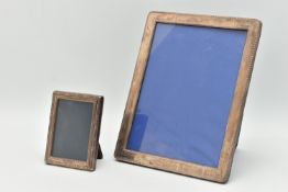TWO SILVER PHOTO FRAMES, the first of a rectangular form, approximate outer measurements 23cm x 18.