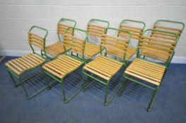 A SET OF EIGHT GREEN PAINTED TUBULAR STACKING CHAIRS, with teak slatted seats and back rests,