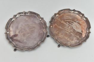 TWO SILVER 'GOLFING SOCIETY' SILVER WAITERS, each of a circular form with wavy rim, on three