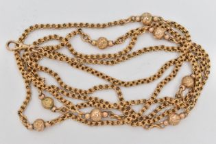 A YELLOW METAL LONG GUARD CHAIN, designed as a belcher link chain with spherical bead accents with