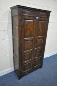A REPRODUCTION SOLID OAK HALL ROBE, with double panelled doors, enclosing a single shelf and four
