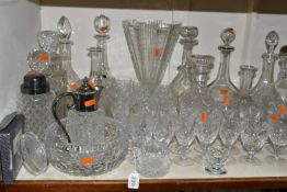 A QUANTITY OF CUT CRYSTAL, over fifty pieces to include twelve decanters, a large geometric vase,