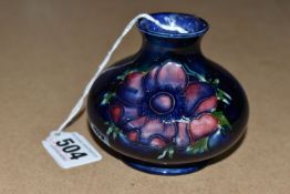 A MOORCROFT POTTERY SQUAT BALUSTER VASE DECORATED WITH ANEMONES ON A MOTTLED BLUE GROUND,