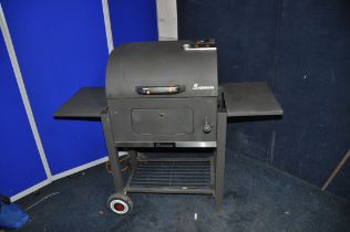 A LANDMANN SOLID FUEL BARBECUE with domed lid, temperature gauge, height adjustable fuel tray,