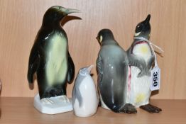THREE CERAMIC PENGUIN FIGURES, comprising a Beswick Courting Penguins figure group, model no 1015, a