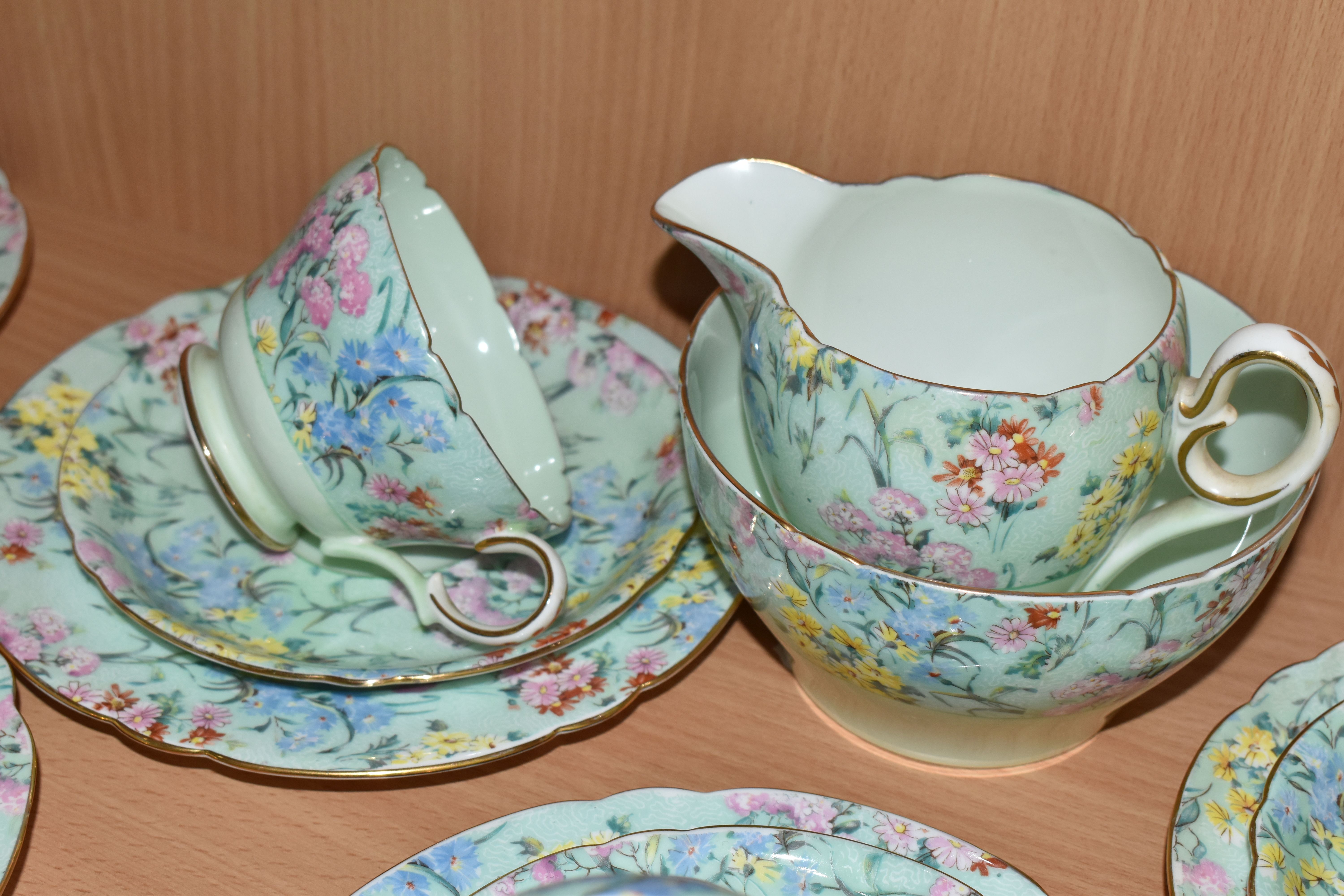 A TWENTY FIVE PIECE SHELLEY 'MELODY' TEA SET, comprising a teapot, a cake plate, a cream jug, a - Image 7 of 12