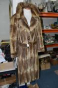 A LADIES BELTED FUR COAT, light brown fur, button detail on cuffs, belted, approximately UK size