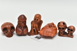 FOUR 20TH CENTURY CARVED TREEN NETSUKE AND AN OKIMONO, carved as a human skeleton, human skulls