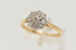 A DIAMOND CLUSTER RING, round brilliant and single cut diamonds set in a white metal mount,