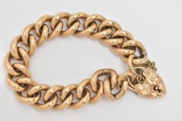 A YELLOW METAL BRACELET WITH 9CT GOLD PADLOCK CLASP, the curb link chain with floral design hinged
