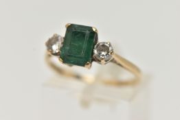 A 9CT GOLD EMERALD AND DIAMOND RING, designed as a central emerald cut emerald in a four claw