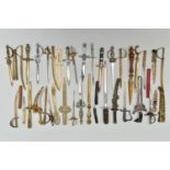 THIRTY SEVEN LETTER OPENERS IN THE FORM OF SWORDS / DAGGERS, including a horn handled white metal