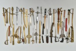 THIRTY SEVEN LETTER OPENERS IN THE FORM OF SWORDS / DAGGERS, including a horn handled white metal