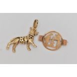A PENDANT AND A BROOCH, the pendant designed as an articulated dog, with 9ct hallmark, the brooch of