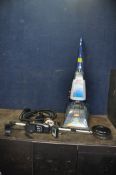 A VAX RAPIDE CARPET WASHER with some accessories (PAT pass and working) and a Chinese made metal