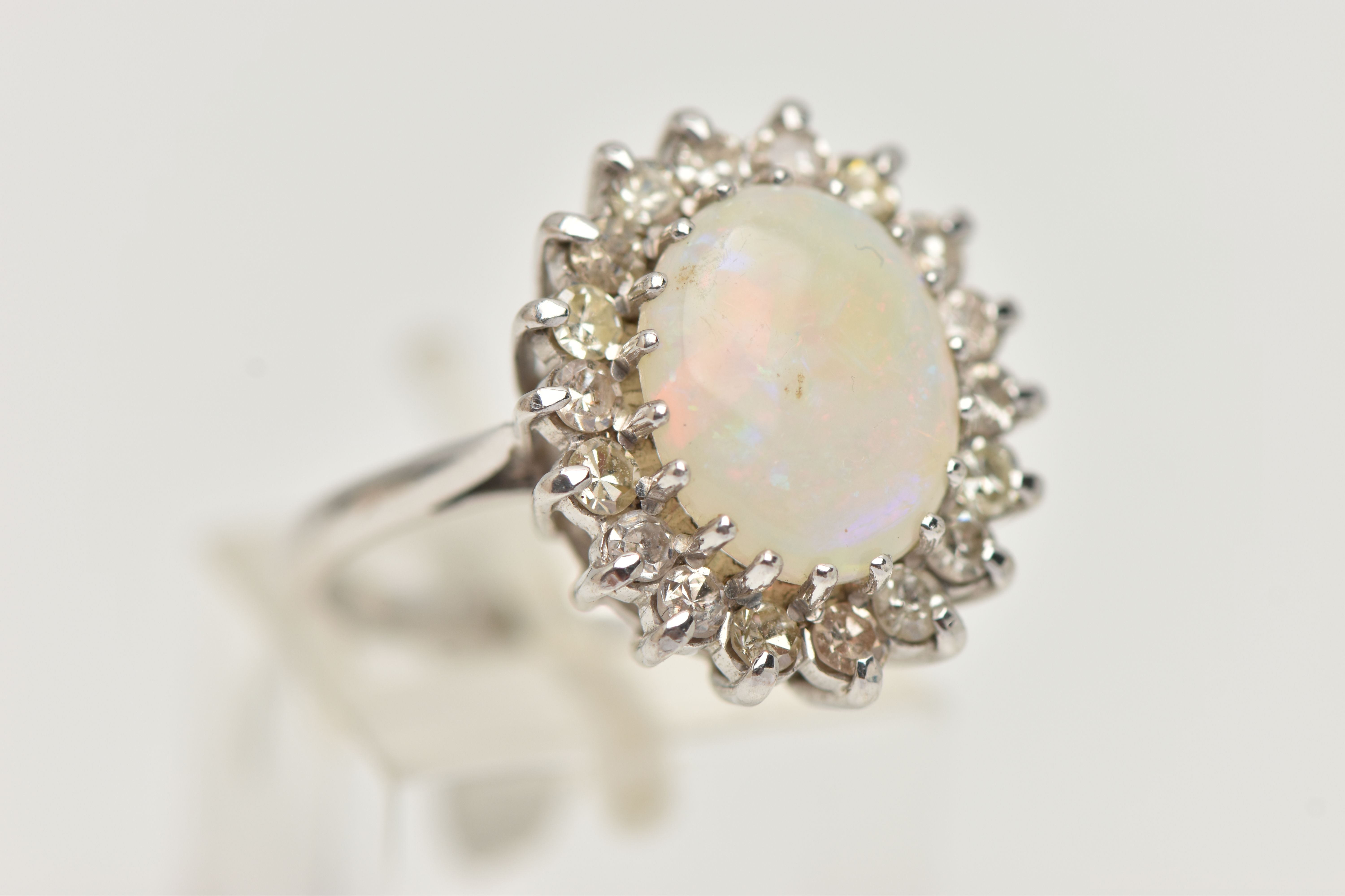 AN OPAL AND DIAMOND CLUSTER RING, designed as a central oval opal cabochon within a single cut - Image 4 of 4
