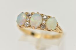 A LATE VICTORIAN OPAL AND DIAMOND RING, designed as three oval opal cabochons interspaced by a total