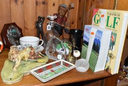 A GROUP OF GOLFING RELATED ITEMS, to include a Stuart Crystal round decanter with golfer design, a