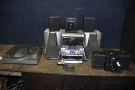 A SELECTION OF AUDIO EQUIPMENT comprising of two Bush NE 8061 mini hi fi's both with remotes, a Bush