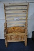 A MODERN PINE SINGLE BEDSTEAD, with siderails, slats and bolts (condition report: general signs of
