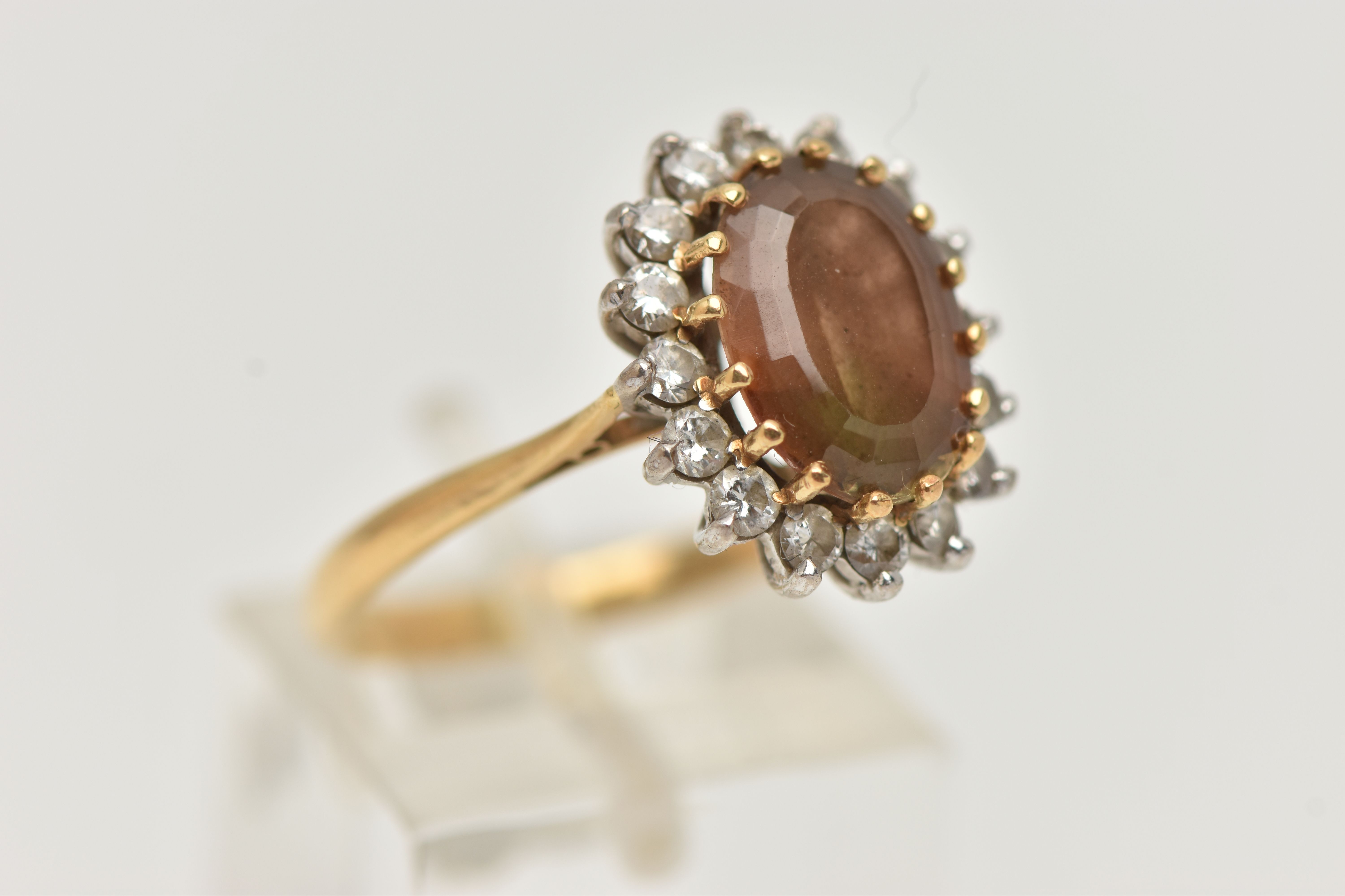 AN 18CT GOLD SMOKY QUARTZ AND DIAMOND CLUSTER RING, the oval smoky quartz within a brilliant cut - Image 4 of 4