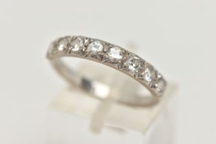 A DIAMOND HALF ETERNITY RING, eight round brilliant cut diamonds grain set in white metal,