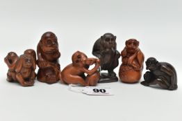 FIVE 20TH CENTURY CARVED TREEN NETSUKE AND AN OKIMONO, all in the form of monkeys with inset eyes,
