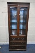 A DREXEL HERITAGE CHIPPENDALE BOOKCASE, the two glazed doors enclosing three adjustable shelves,