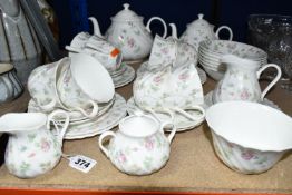 A WEDGWOOD 'ROSEHIP' PATTERN TEA SET, comprising teapot, milk jug, sugar bowl, a small teapot,