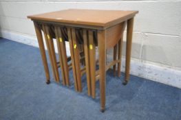 A SET OF MID CENTURY TEAK PAUL HUNDEVAD NESTING TABLES, comprising one large table and four