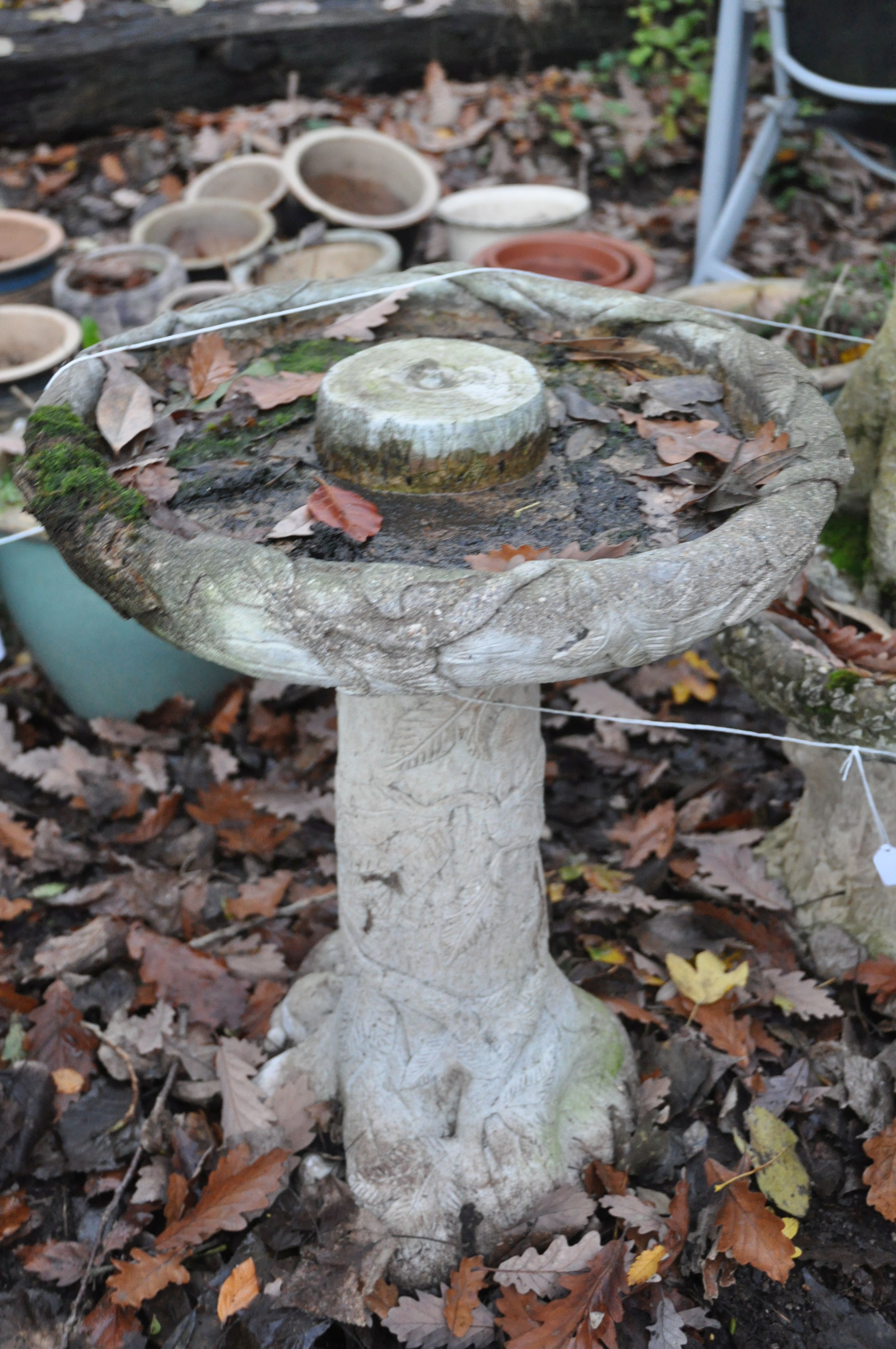 A WEATHERED COMPOSITE BIRD BATH, of a tree type form, diameter 47cm x height 62cm, and another - Image 2 of 3