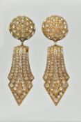 A PAIR OF 'ASKEW' CLIP ON EARRINGS, a pair of large statement earrings, yellow metal and paste,