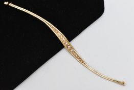 A 9CT GOLD DIAMOND SET BRACELET, mesh bracelet, set with a row of five raised claw set, round