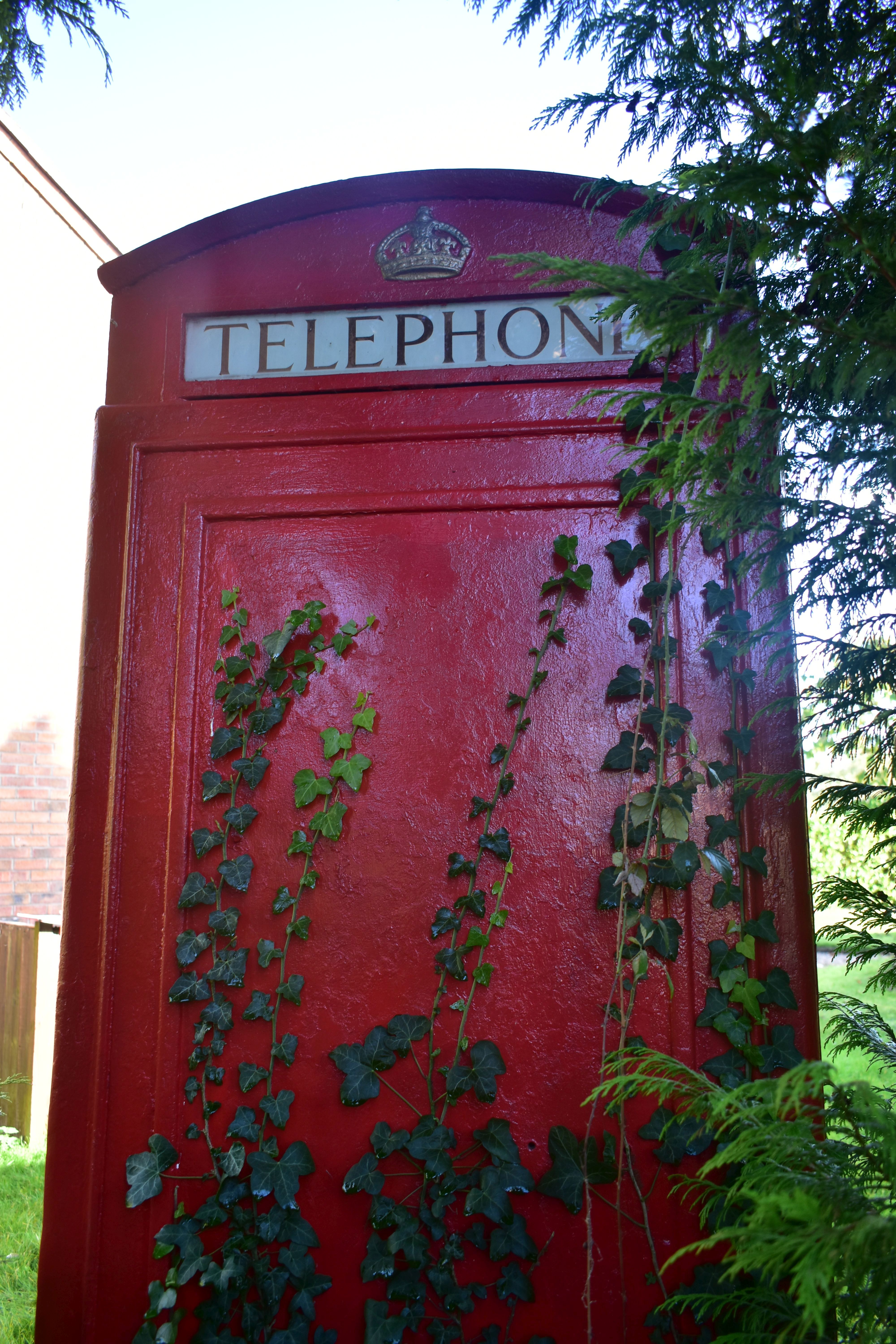 A K6 RED TELEPHONE BOX, the distinctive shape with a domed top, crown and telephone sign to all - Image 12 of 17