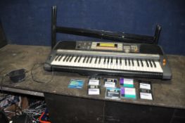 A YAMAHA PSR-640 ELECTRONIC KEYBOARD with power supply, stand and nine diskettes)(PAT fail due to
