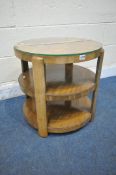 AN ART DECO WALNUT THREE TIER CIRCULAR OCCASIONAL TABLE, the top surface quarter veneered, with a