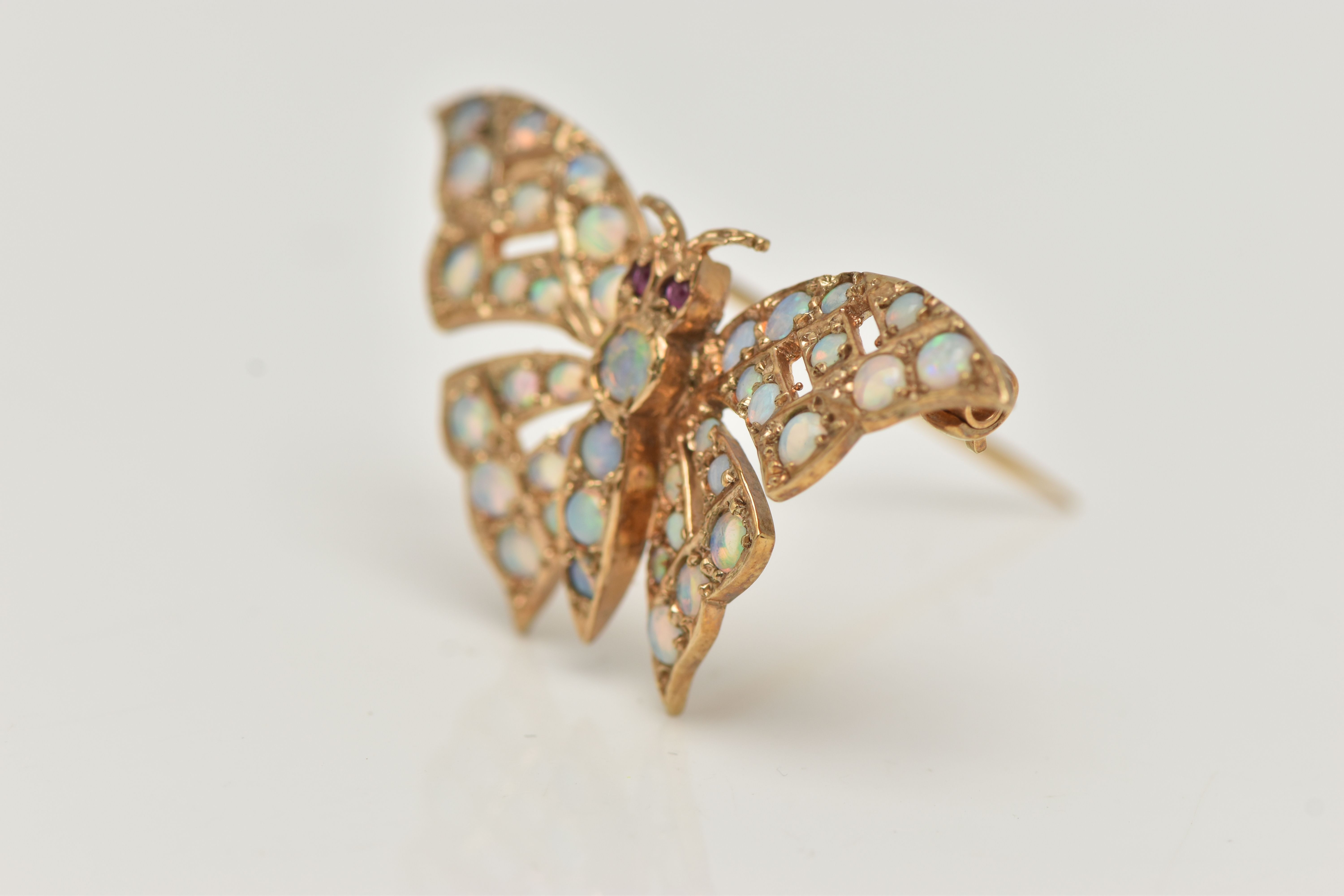 A 9CT GOLD OPAL AND RUBY BUTTERFLY BROOCH, the butterfly body and wings set with circular opal - Image 3 of 4