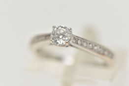 A 'THE FOREVER DIAMOND' DIAMOND RING, a round brilliant cut diamond four prong set in white gold,