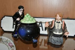 A HARRY POTTER COOKIE JAR, Harry Potter standing next to a large bubbling cauldron, wand in hand,